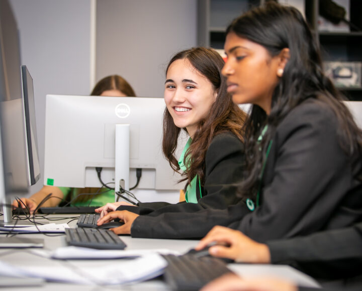 Students using computers in a King Edward VI Foundation classroom, engaging in digital learning activities.